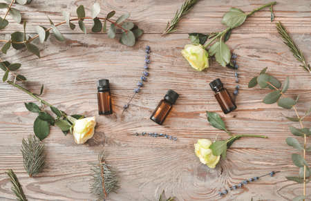 Bottles of different essential oils on tableの写真素材