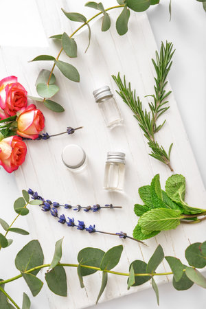 Bottles of different essential oils on white backgroundの写真素材