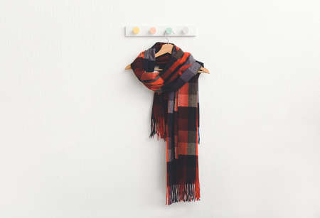 Hanger with beautiful scarf on white backgroundの写真素材