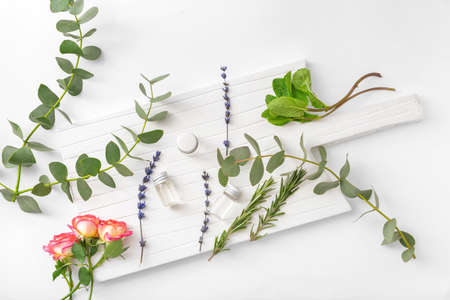 Bottles of different essential oils on white backgroundの写真素材