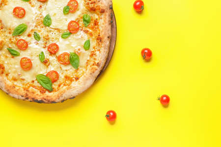 Delicious pizza Margherita on color backgroundの写真素材