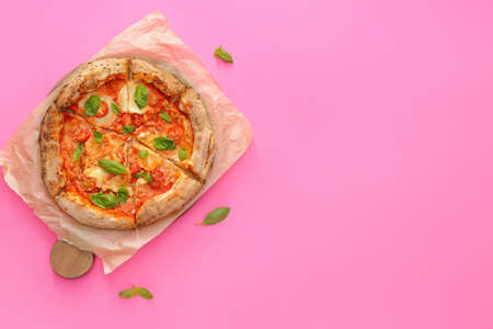 Delicious pizza Margherita on color backgroundの写真素材