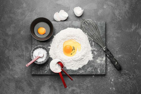 Ingredients for dough on dark backgroundの写真素材