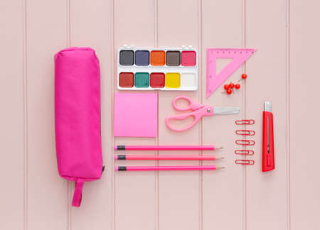 Pencil case and school stationery on wooden backgroundの写真素材