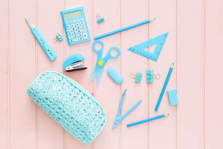 Pencil case and school stationery on wooden backgroundの写真素材