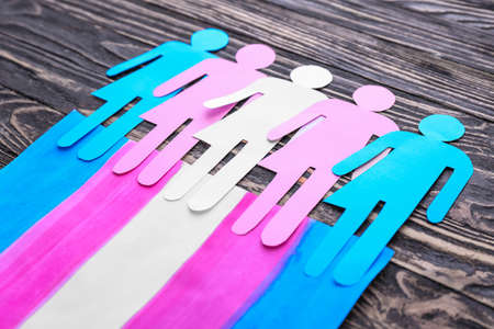 Human figures with flag of transgender on wooden backgroundの写真素材