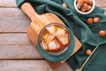 Glass of tasty iced coffee on tableの写真素材