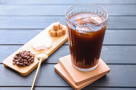 Glass of tasty iced coffee on tableの写真素材