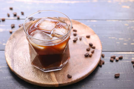 Glass of tasty iced coffee on tableの写真素材