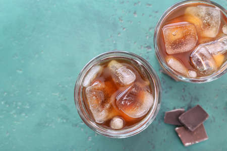 Glasses of tasty cold coffee on tableの写真素材
