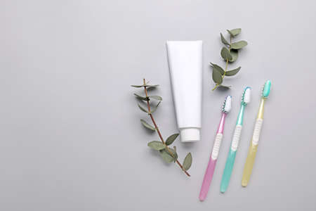 Tooth brushes with paste on light backgroundの写真素材