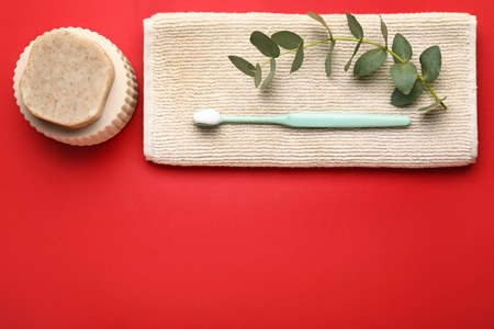 Tooth brush, towel and soap on color backgroundの写真素材