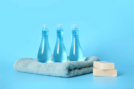 Shampoo, towel and soap on color backgroundの写真素材