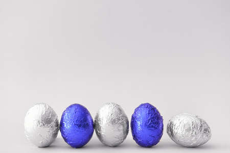 Sweet chocolate eggs on light backgroundの写真素材