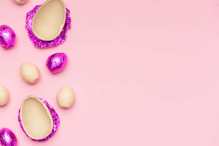 Sweet chocolate eggs on color backgroundの写真素材