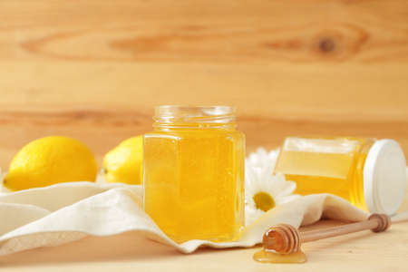 Jar of sweet honey on tableの写真素材