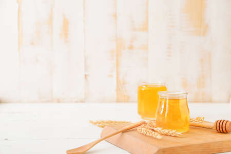 Jar of sweet honey on tableの写真素材