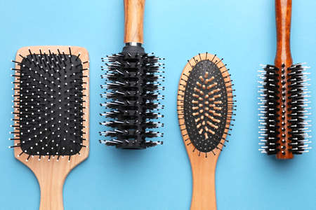 Hair brushes on color backgroundの写真素材
