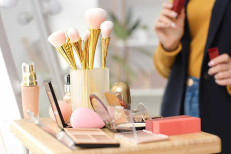 Female makeup artist with decorative cosmetics in beauty salon, closeupの写真素材