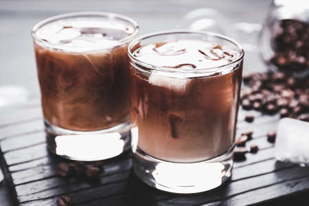Glasses of tasty iced coffee on tableの写真素材