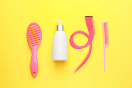 Set of hairdresser's accessories on color backgroundの写真素材