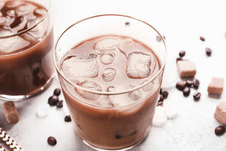 Glasses of tasty iced coffee on tableの写真素材