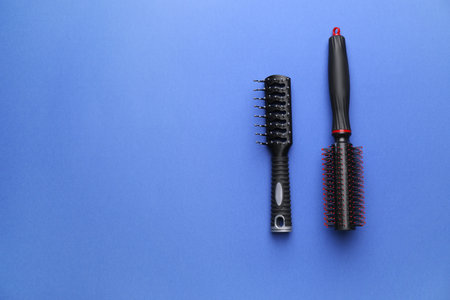 Hair brushes on color backgroundの写真素材