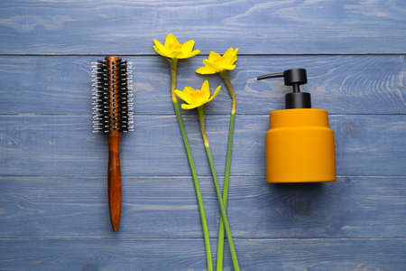 Hair brush with soap on color wooden backgroundの写真素材