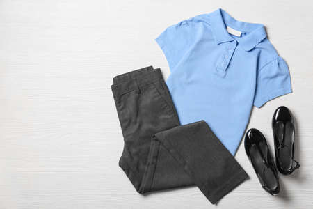 Stylish school uniform on white wooden backgroundの写真素材