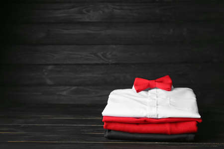 Stylish school uniform on dark wooden backgroundの写真素材