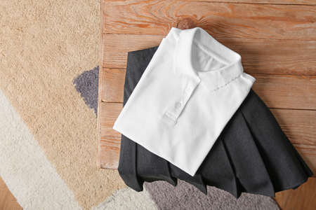 Stylish school uniform on wooden tableの写真素材