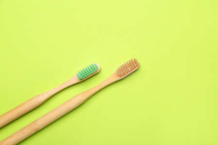 Wooden tooth brushes on color backgroundの写真素材