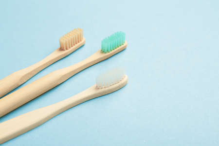 Wooden tooth brushes on color backgroundの写真素材