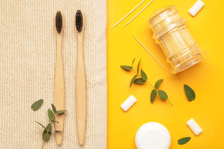 Set for oral hygiene with towel on color backgroundの写真素材