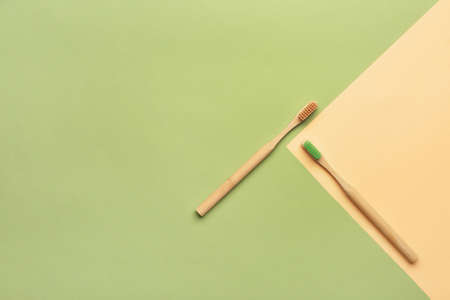 Wooden tooth brushes on color backgroundの写真素材