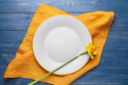 Clean napkin with plate on wooden backgroundの写真素材