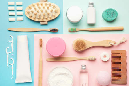 Tooth brushes with bath supplies on color backgroundの写真素材
