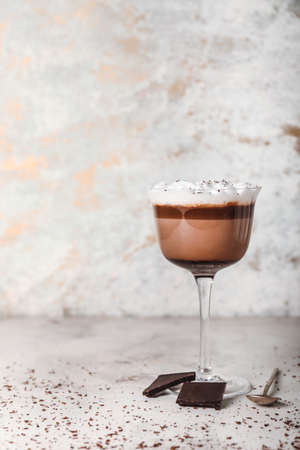 Glass of hot chocolate on white backgroundの写真素材