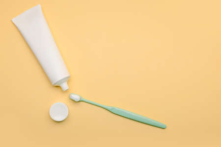 Tooth brush with paste on color backgroundの写真素材