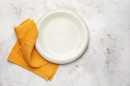 Clean napkin with plate on white backgroundの写真素材