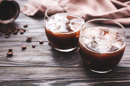 Glasses of tasty iced coffee on tableの写真素材