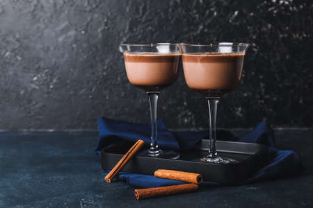 Glasses of hot chocolate on dark backgroundの写真素材