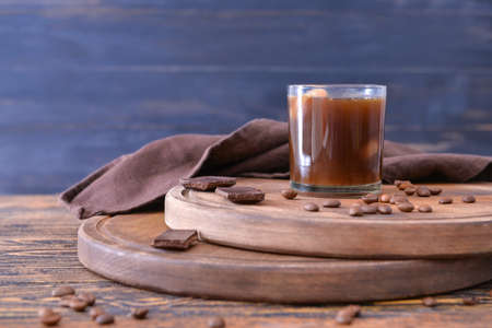 Glass of tasty iced coffee on tableの写真素材