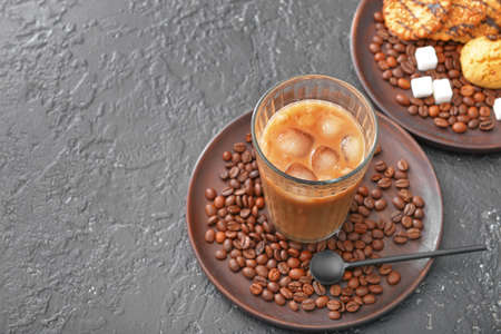 Glass of tasty iced coffee on dark backgroundの写真素材