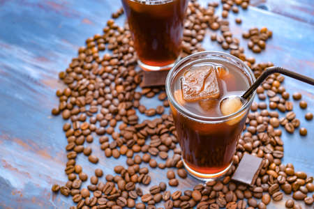 Glass of tasty iced coffee on tableの写真素材