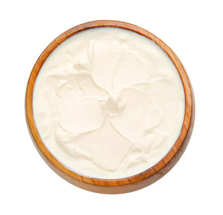 Bowl with tasty sour cream on white backgroundの写真素材