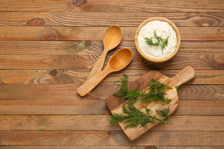 Composition with tasty sour cream on tableの写真素材