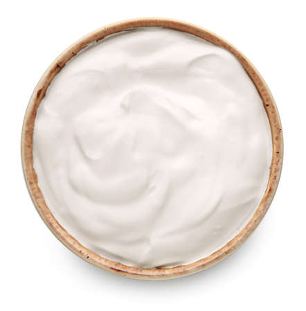 Bowl with tasty sour cream on white backgroundの写真素材