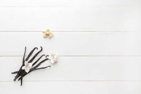 Aromatic vanilla sticks on white wooden backgroundの写真素材