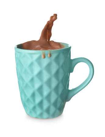 Cup with splashing cocoa drink isolated on whiteの写真素材